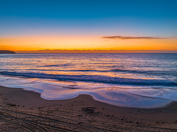 Sunrise at the seaside with orange horizon