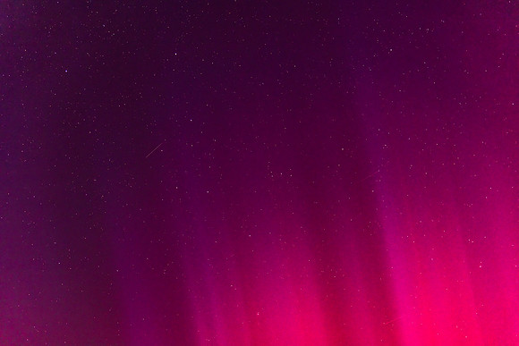 Aurora Australis vibrant display lights up the predawn sky in pi