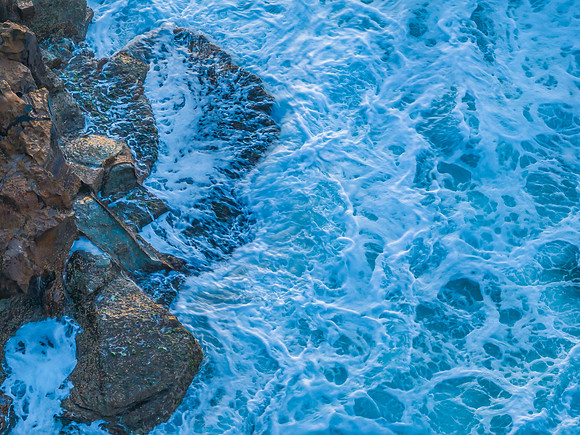 Top down sunrise over the sea and rock platform