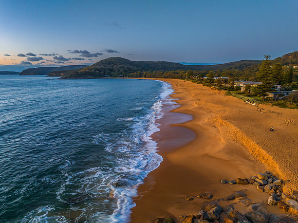 Aerial sunrise views over the ocean and beach