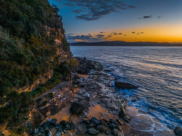 Aerial sunrise views over the ocean and beach