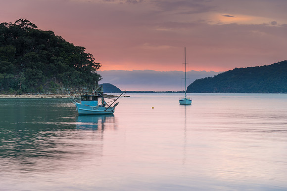 Serene Morning Waterscape with Soft Clouds over the Bay