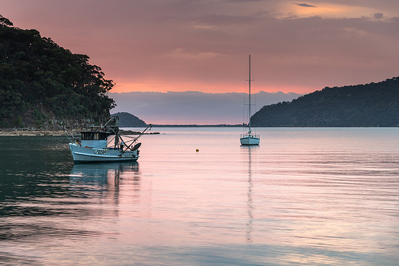 Serene Morning Waterscape with Soft Clouds over the Bay