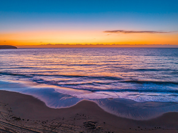 Sunrise at the seaside with orange horizon
