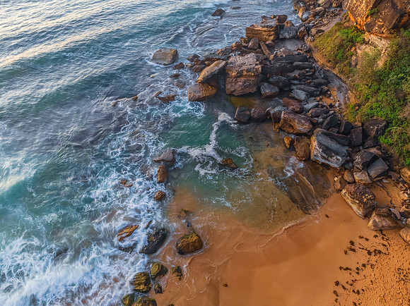 Rocks and sea action in the early morning light