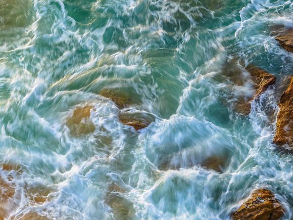 Rocks and sea action in the early morning light