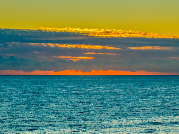 Sunrise blues over the sea and rocky Inlet