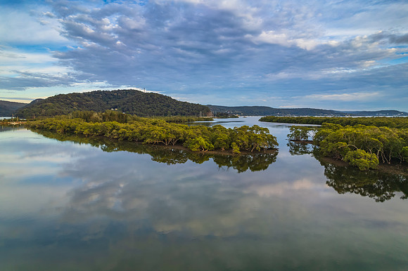 Clouds and reflections early morning waterscape