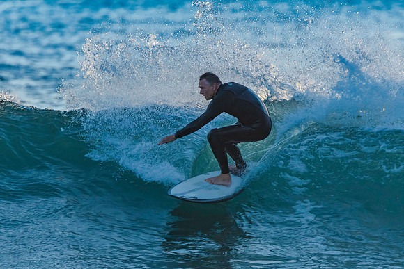 Surfers and Sunrise at the seaside