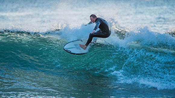 Surfers and Sunrise at the seaside