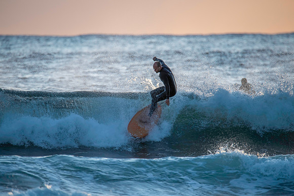 Surfers and Sunrise at the seaside
