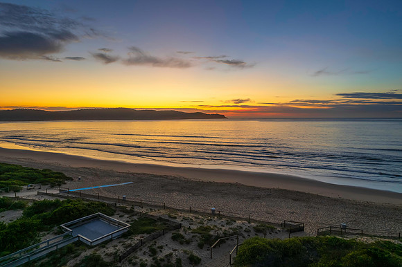 Sunrise seascape with a mix of high and medium clouds