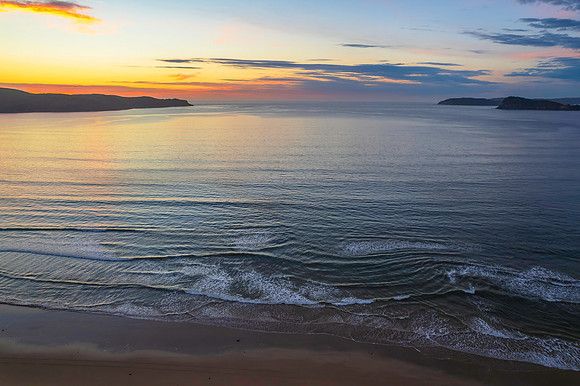 Sunrise seascape with a mix of high and medium clouds