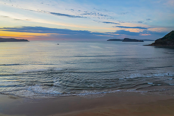 Sunrise seascape with a mix of high and medium clouds
