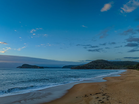 Sunrise, clouds and surf at the seaside
