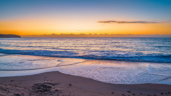 Sunrise at the seaside with orange horizon
