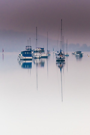 Smoke Haze and Boat Reflections on the Bay