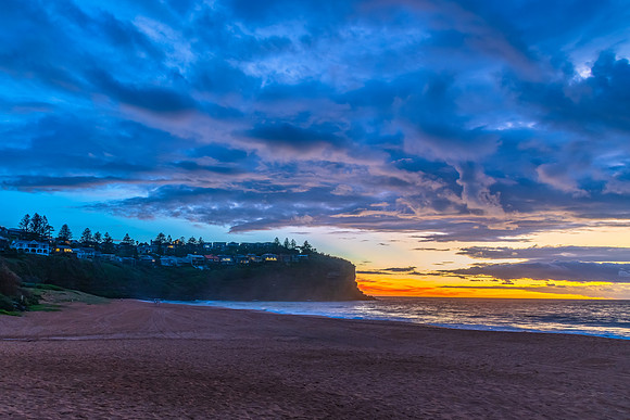 Sunrise at the Seaside with rain clouds