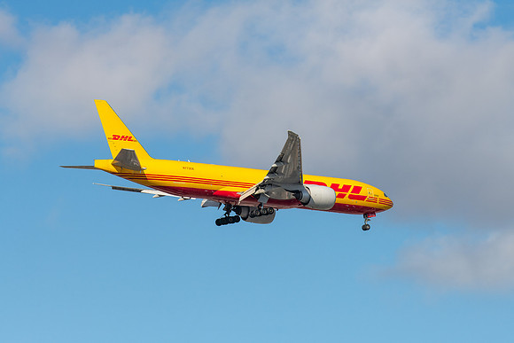 N773CK - Boeing 777-F - DHL Airline flying in the cloudy afterno