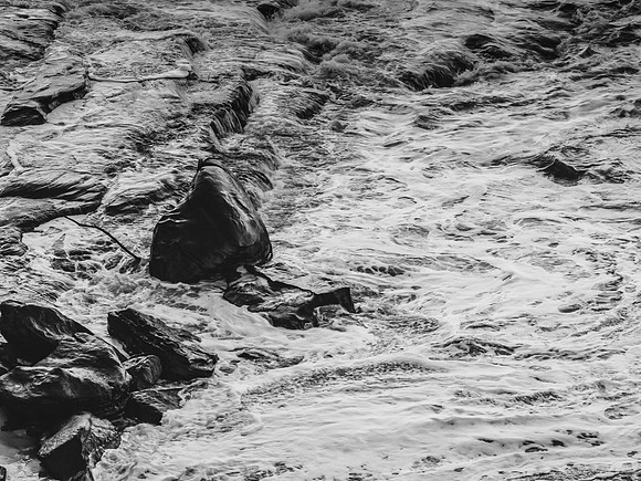 Early morning monochrome rocks and the sea
