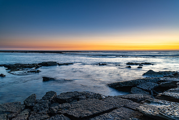 Sunrise Seascape with Soft Cloud on the Horizon