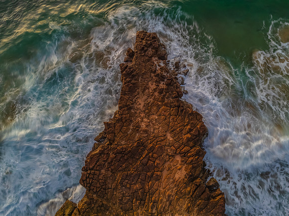Top down sunrise over the sea and rock platform