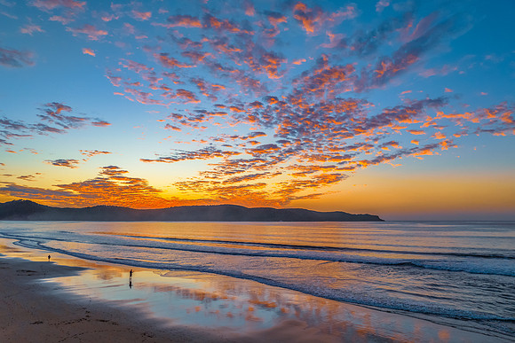Sunrise seascape with pretty clouds in the sky