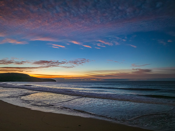 Winter seascape views over the beach with high and medium cloud