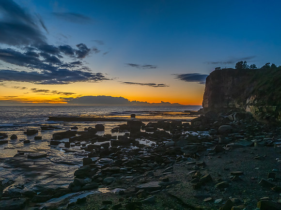 Sunrise over the ocean and rocky Inlet