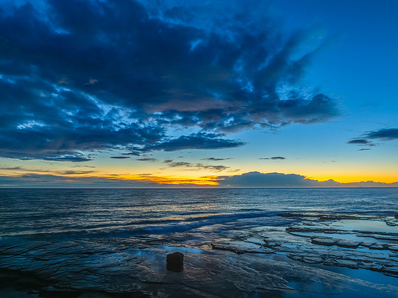 Sunrise over the ocean and rocky Inlet