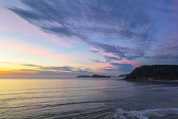 Sunrise seascape with a mix of high and medium clouds