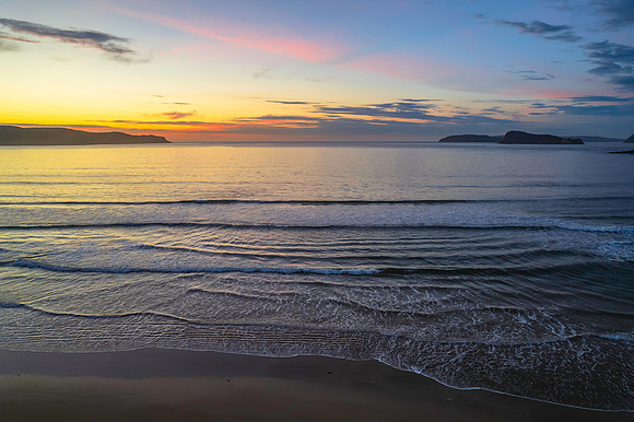 Sunrise seascape with a mix of high and medium clouds