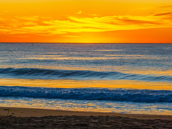 Sunrise at the seaside with high cloud