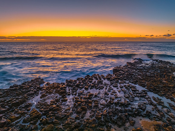 Sunrise over the sea and rock platform