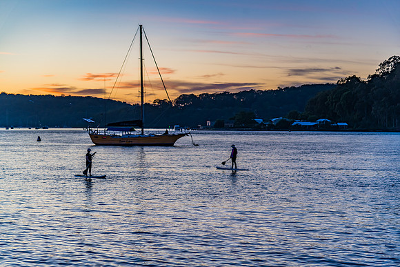 Paddleboarding around the boats at Dawn Waterscape