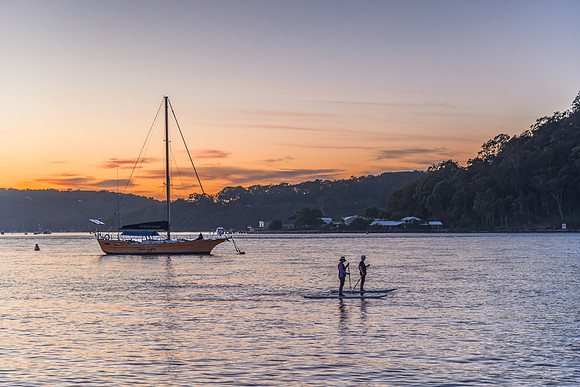 Paddleboarding around the boats at Dawn Waterscape