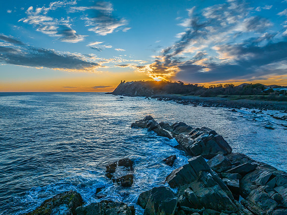 Coastal Sunrise with Rock Formations