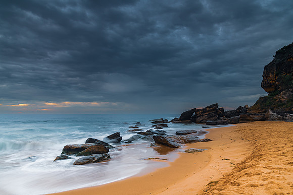 Sunrise at the seaside with rocks and beautiful diffused light b