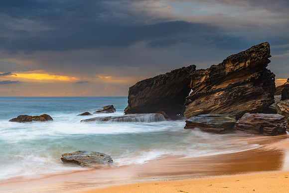 Sunrise at the seaside with rocks and beautiful diffused light b