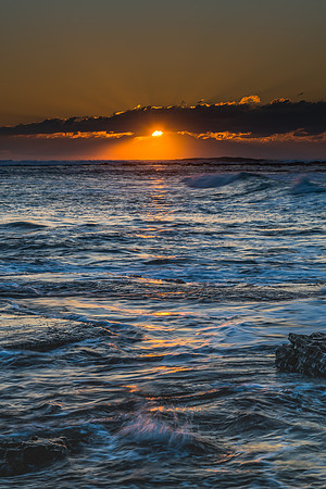Sunrise Seascape with a low cloud bank