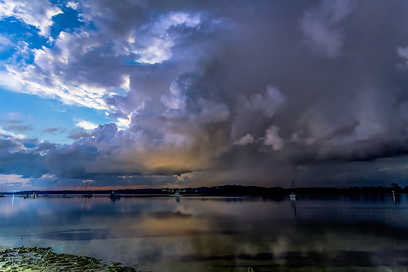 Night Sky with Storm Clouds Rolling In and Boats on the Water