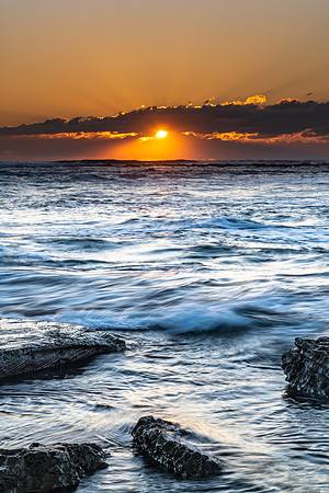 Sunrise Seascape with a low cloud bank