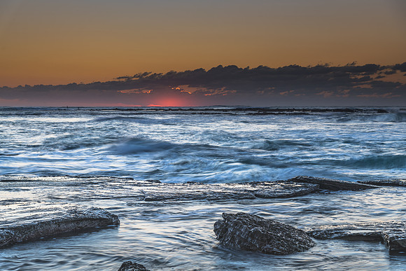 Sunrise Seascape with a low cloud bank