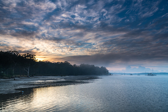 Sunrise Waterscape with High Cloud and Boats