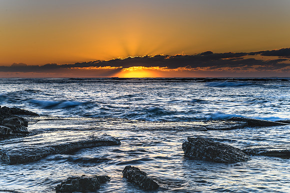Sunrise Seascape with a low cloud bank
