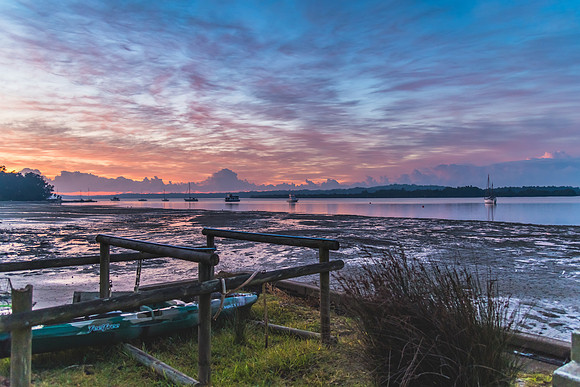 Sunrise Waterscape with High Cloud and Boats