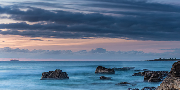 Sunrise Seascape with Clouds and Ships on the Horizon