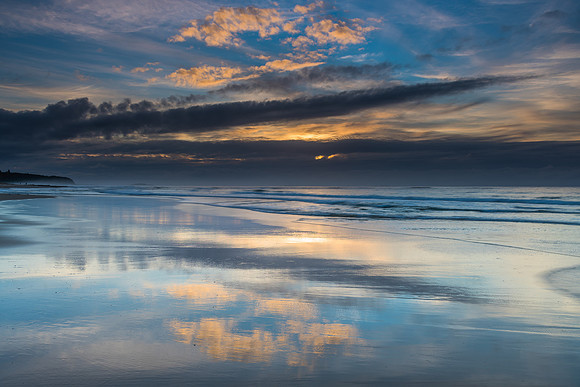 Sunrise Seascape with Clouds and Ships on the Horizon