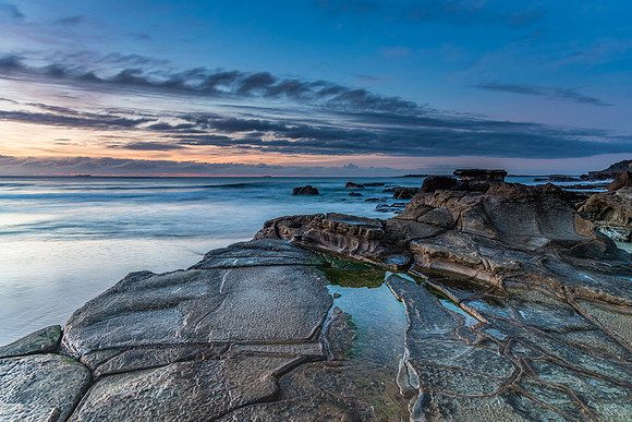 Sunrise Seascape with Clouds and Ships on the Horizon
