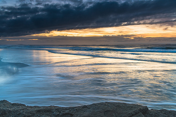 Sunrise Seascape with Clouds and Ships on the Horizon